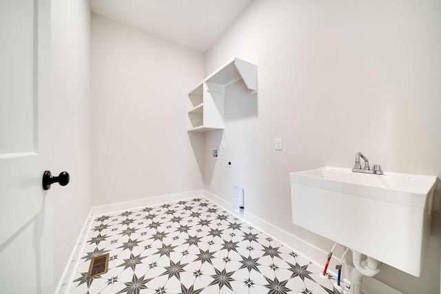 washroom featuring light floors, baseboards, laundry area, electric dryer hookup, and hookup for a gas dryer