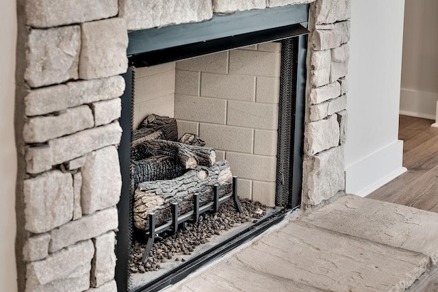 room details with concrete block wall and wood finished floors