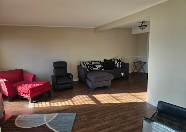 living area with crown molding, baseboards, and wood finished floors