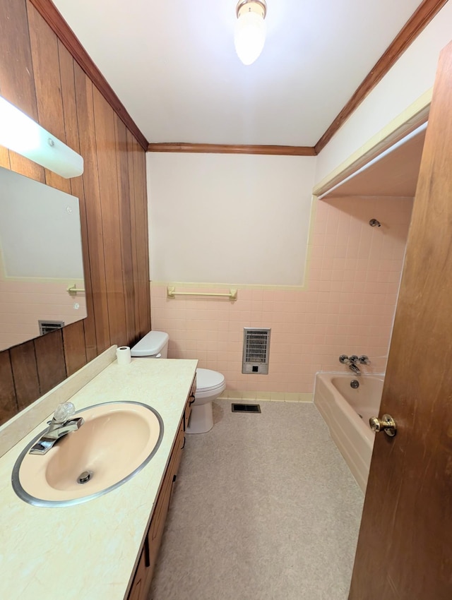 full bath with visible vents, toilet, ornamental molding, heating unit, and vanity