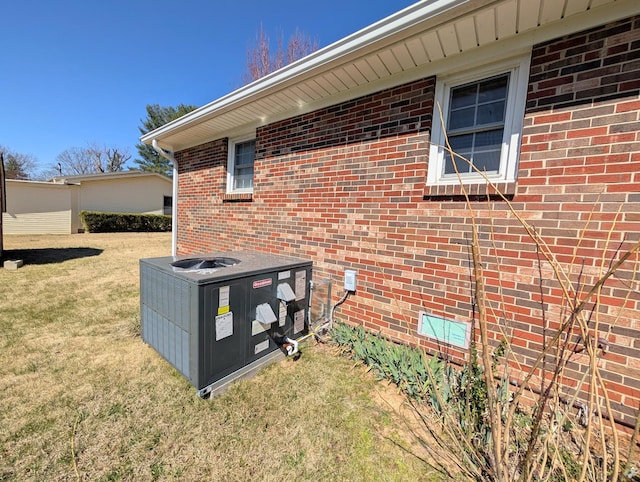 details with brick siding and central AC unit