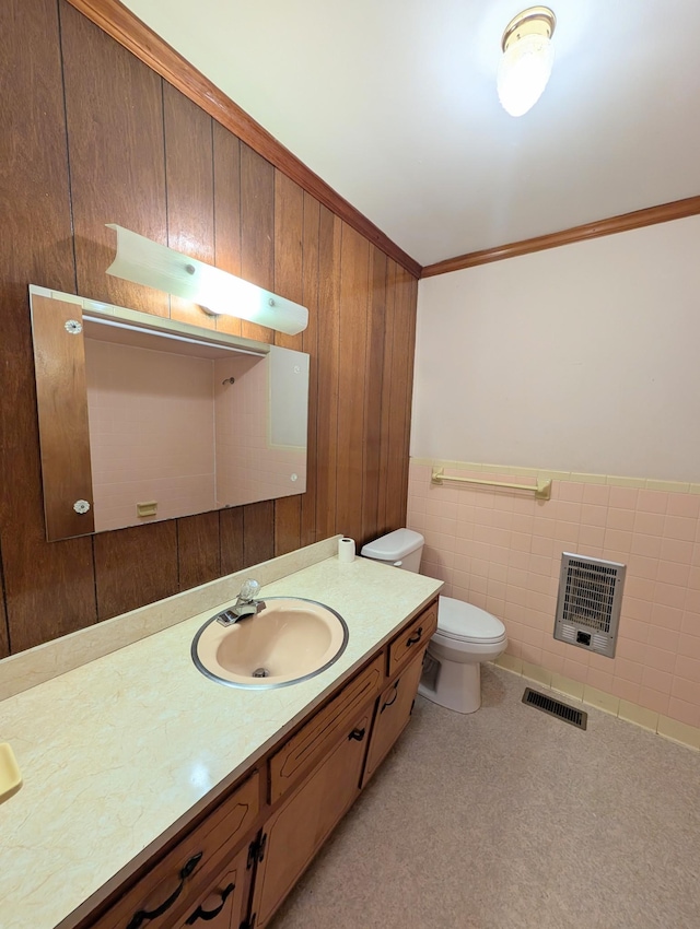 bathroom with vanity, visible vents, ornamental molding, wainscoting, and toilet