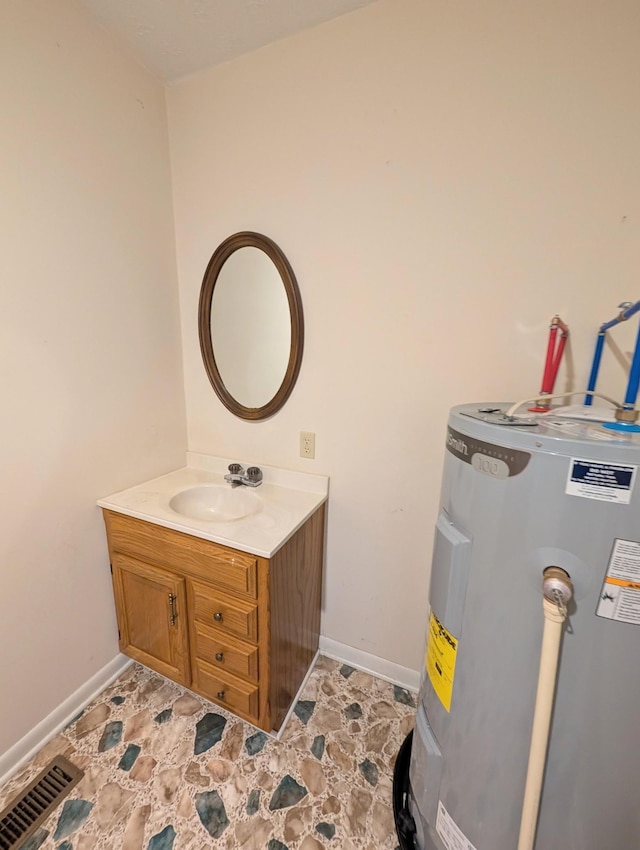 utilities featuring visible vents, electric water heater, and a sink