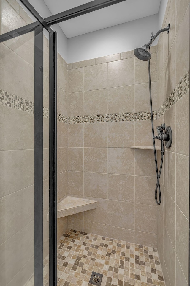 full bath featuring a shower stall