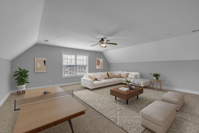 living room featuring visible vents, lofted ceiling, and baseboards