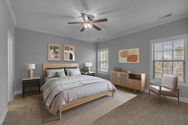 bedroom featuring crown molding, carpet flooring, baseboards, and visible vents