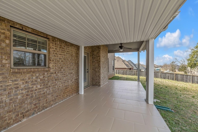 view of patio / terrace featuring fence and ceiling fan