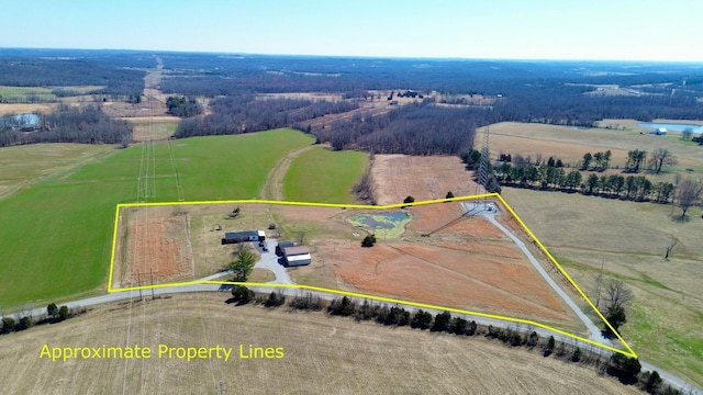 birds eye view of property with a rural view