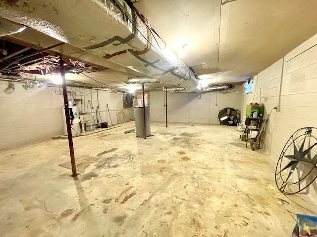 unfinished basement featuring gas water heater and water heater