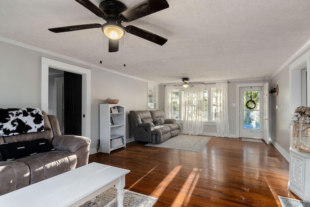 living room with ornamental molding, wood finished floors, baseboards, and a textured ceiling