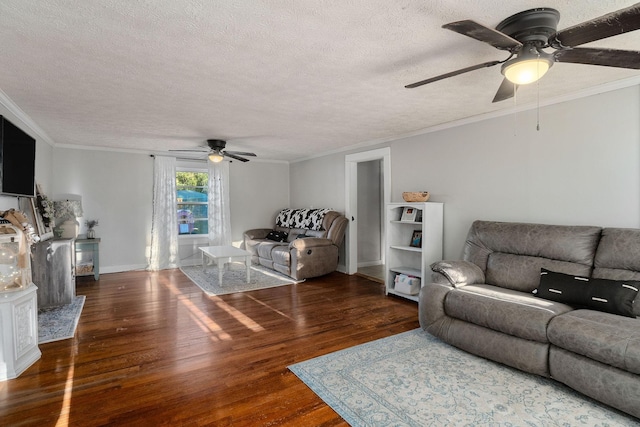 living room with ornamental molding, a textured ceiling, and wood finished floors