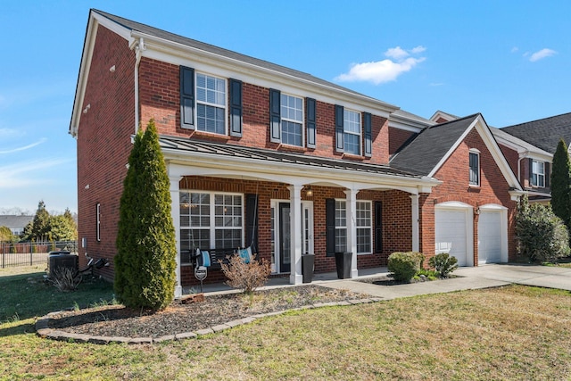 traditional home with brick siding, covered porch, and concrete driveway