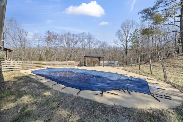 view of pool with a gazebo, a fenced in pool, and fence