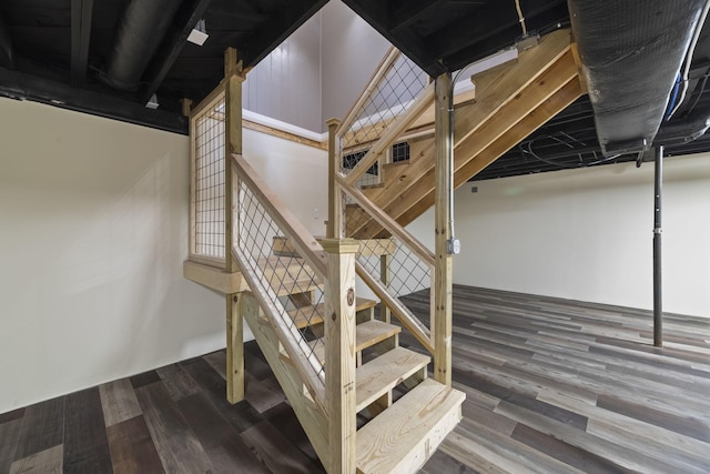 stairway featuring wood finished floors