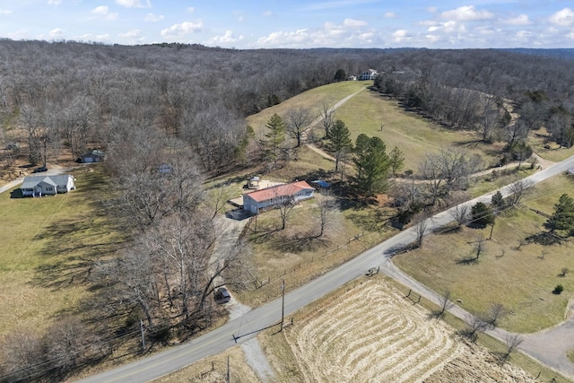 drone / aerial view with a rural view and a view of trees