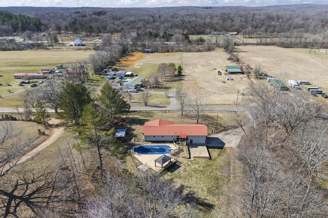 bird's eye view with a rural view and a view of trees