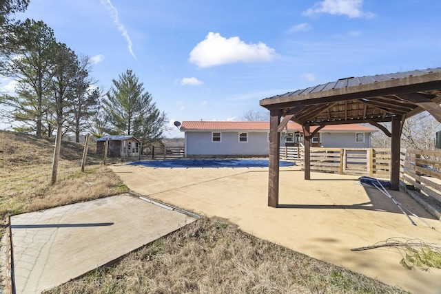 view of patio / terrace featuring a gazebo and fence