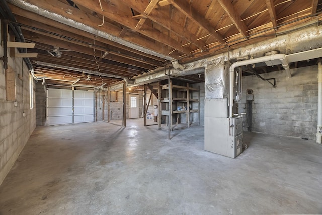 unfinished basement featuring heating unit