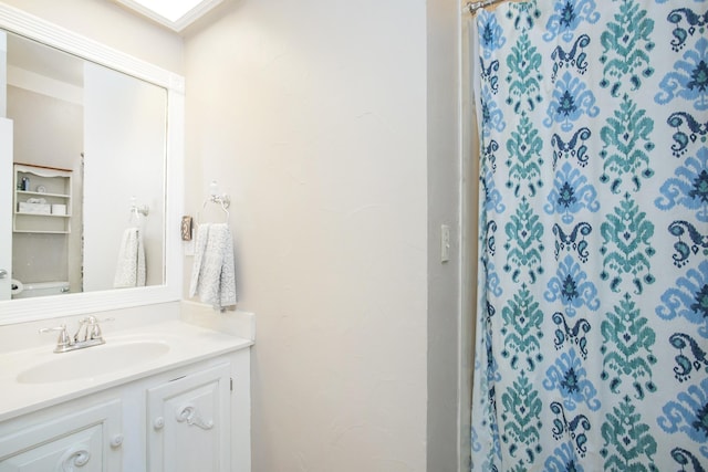 full bath with vanity and a shower with shower curtain