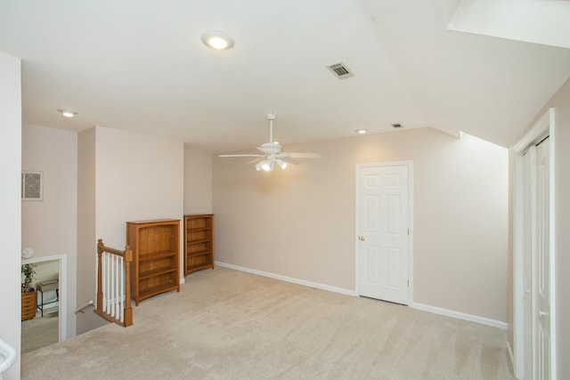 interior space with light carpet, visible vents, and baseboards