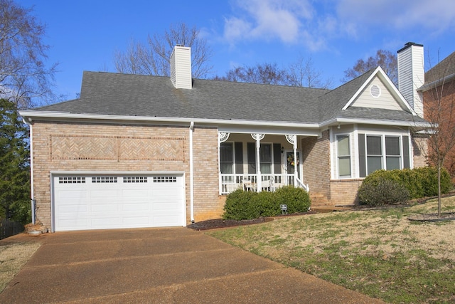 view of front of house featuring driveway, an attached garage, covered porch, a chimney, and brick siding