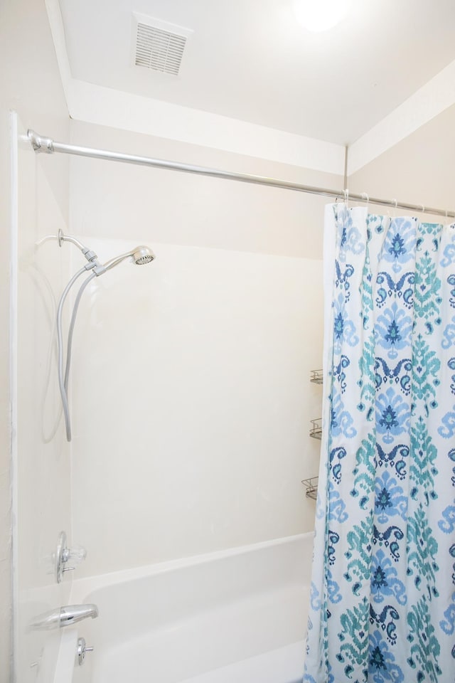 full bathroom featuring visible vents and shower / bath combo