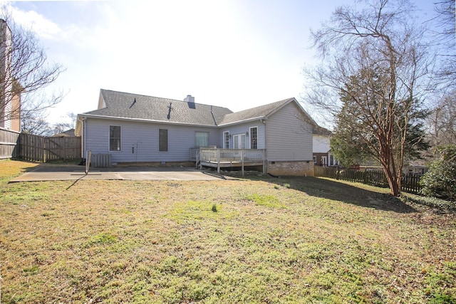 rear view of house featuring a patio area, a lawn, a fenced backyard, and crawl space