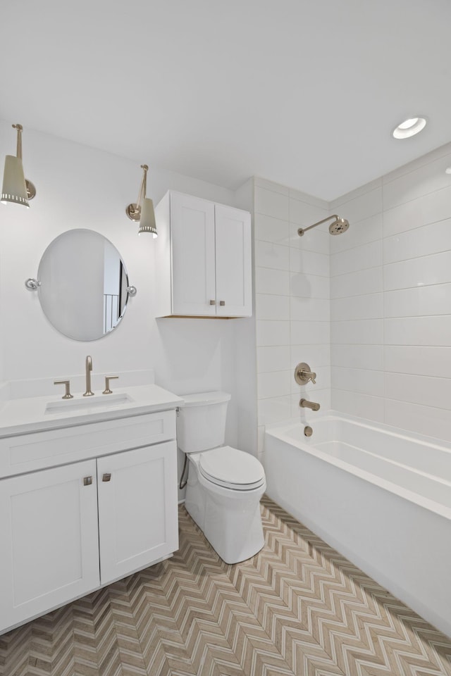 full bath featuring vanity, toilet, and washtub / shower combination