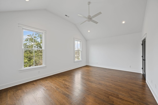 unfurnished room featuring visible vents, baseboards, dark wood finished floors, lofted ceiling, and a ceiling fan