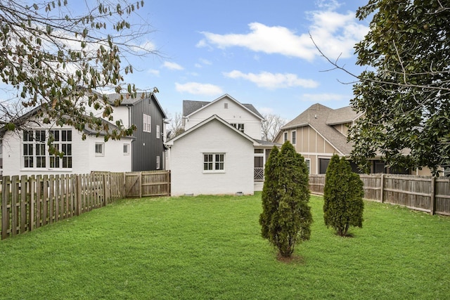 view of yard with a fenced backyard