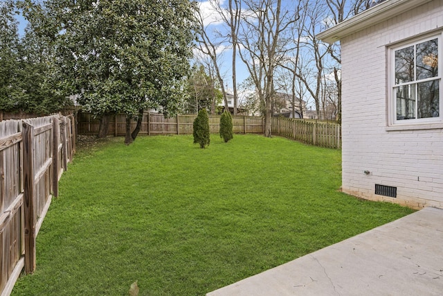 view of yard featuring a fenced backyard