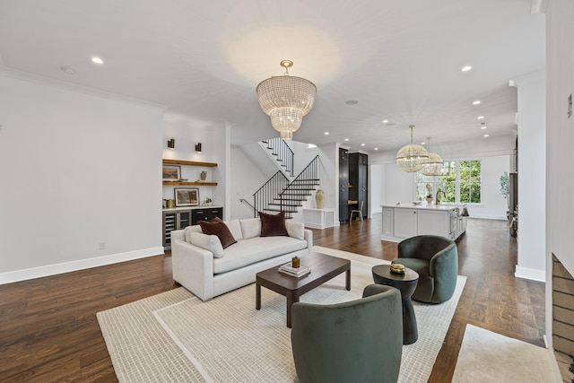 living room featuring dark wood-type flooring, recessed lighting, baseboards, a chandelier, and stairs