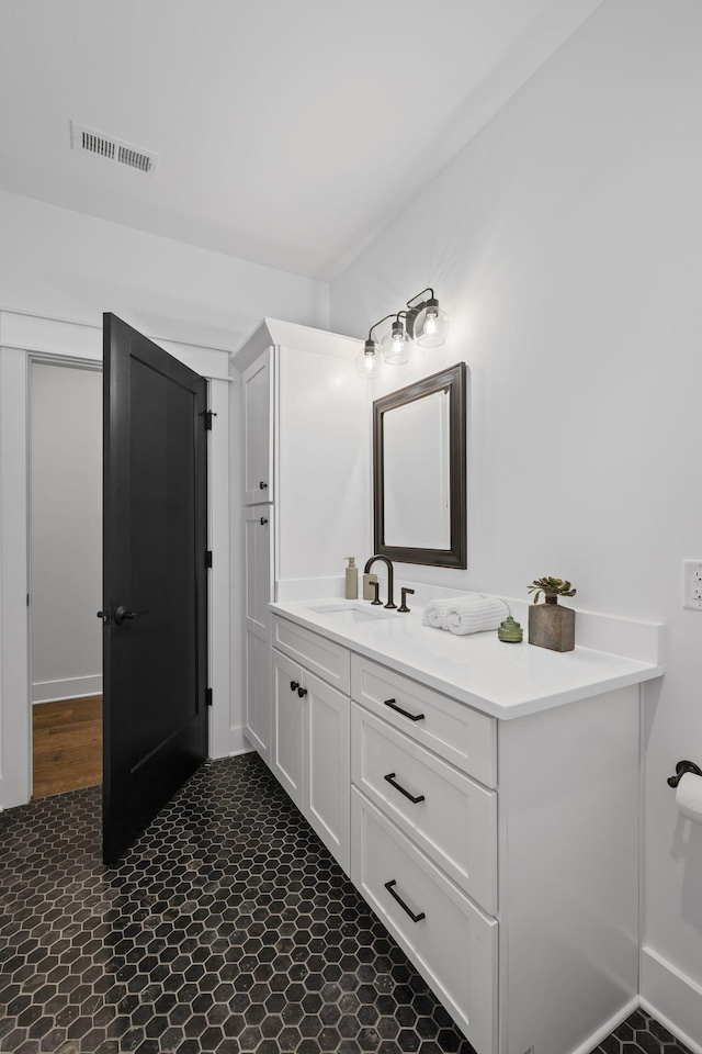 bathroom featuring vanity and visible vents