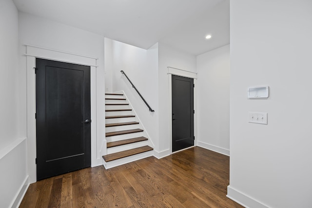 entrance foyer with recessed lighting, stairs, baseboards, and wood finished floors