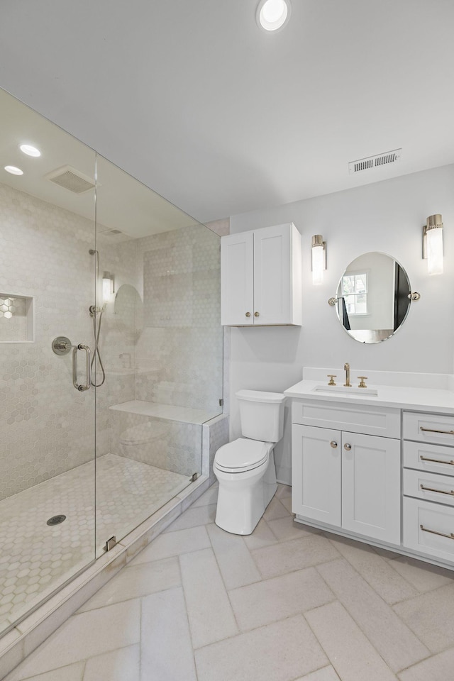 full bath featuring visible vents, toilet, recessed lighting, a shower stall, and vanity