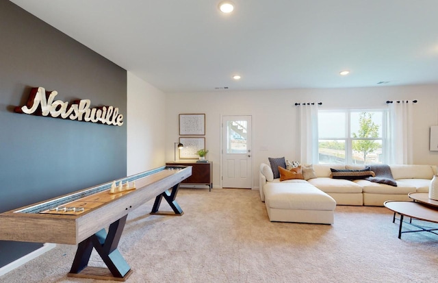 carpeted living room featuring a wealth of natural light, visible vents, recessed lighting, and baseboards