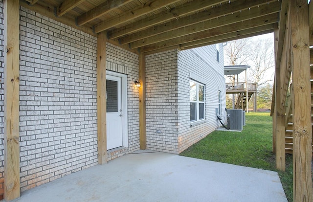 view of patio / terrace featuring central AC unit and stairs