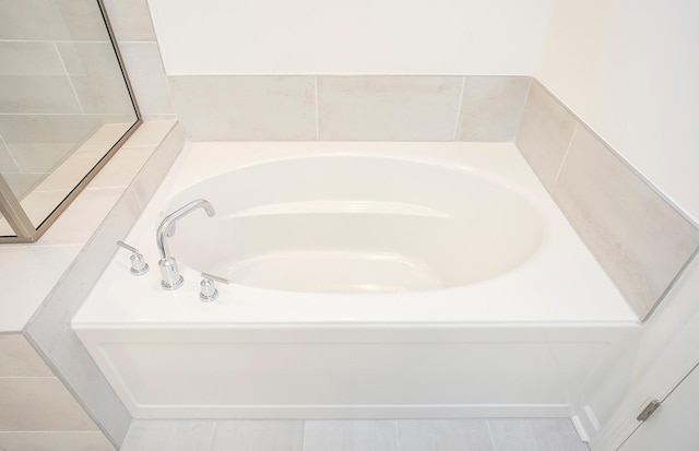 bathroom featuring a garden tub