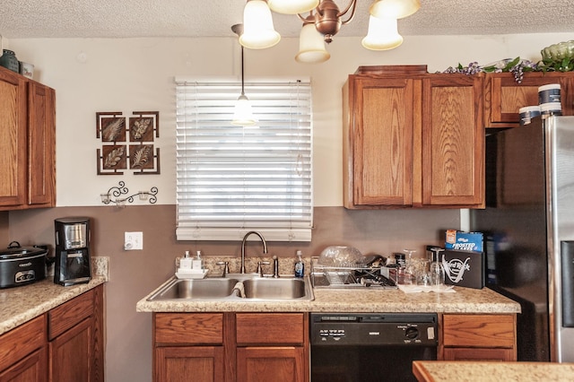 kitchen featuring dishwasher, refrigerator with ice dispenser, brown cabinets, a textured ceiling, and a sink