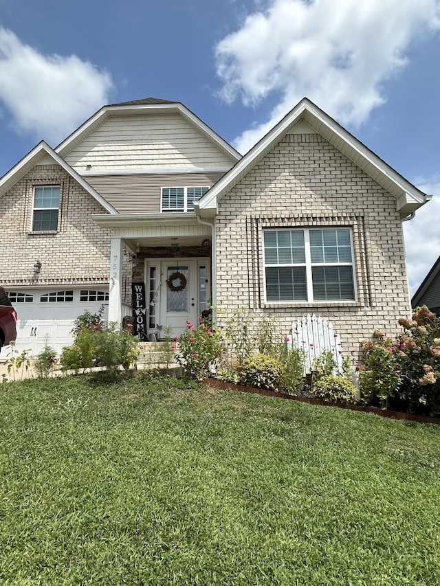 view of front of house featuring a front lawn and brick siding