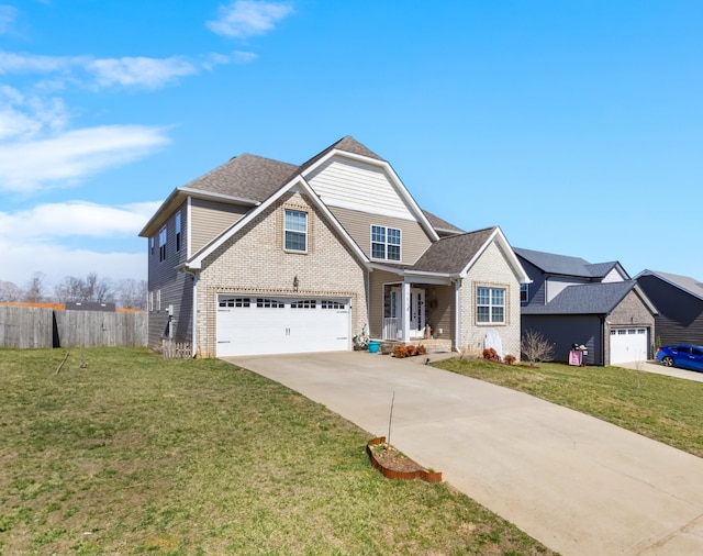 traditional-style house with a front yard, fence, driveway, roof with shingles, and a garage