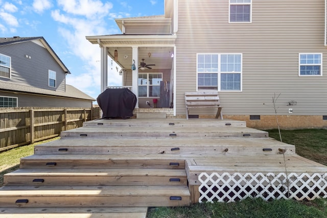 back of house with crawl space, a wooden deck, a ceiling fan, and fence