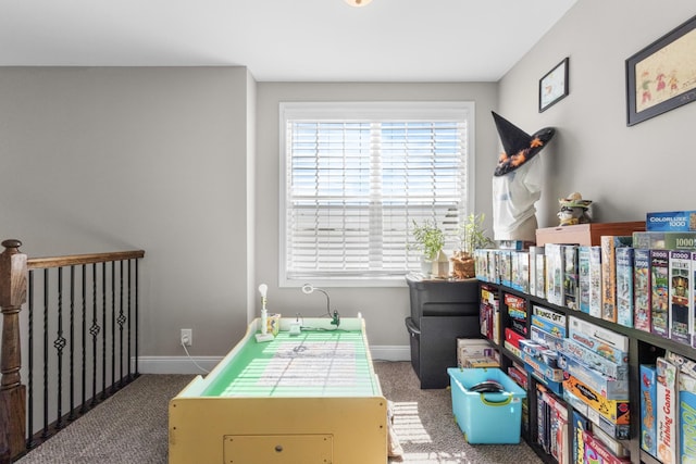 playroom with baseboards and carpet flooring