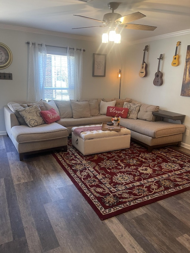 living room with baseboards, crown molding, a ceiling fan, and wood finished floors