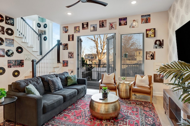 living room with recessed lighting, stairway, light wood-style floors, and a ceiling fan