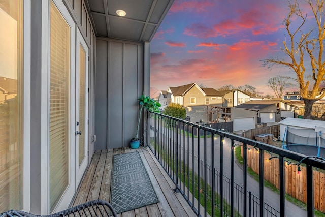 balcony at dusk with a residential view