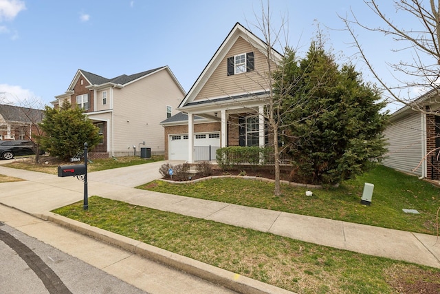 view of front of property with driveway, a front lawn, a garage, central air condition unit, and brick siding