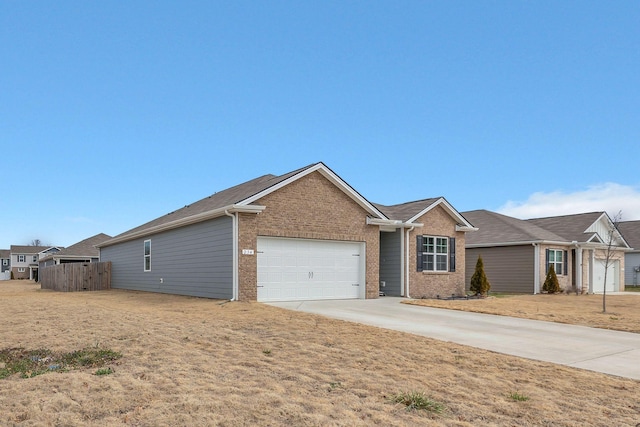 ranch-style house with a garage, brick siding, driveway, and fence