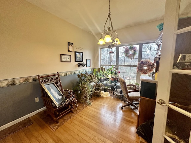 office space featuring a chandelier and wood-type flooring