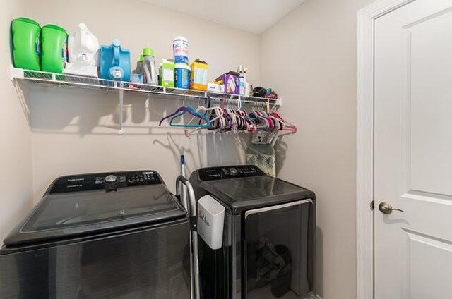 washroom featuring washer and dryer and laundry area